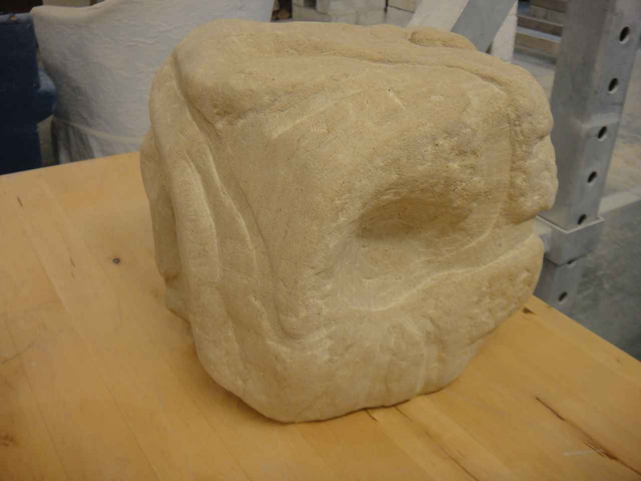 A stone carving lying on a table