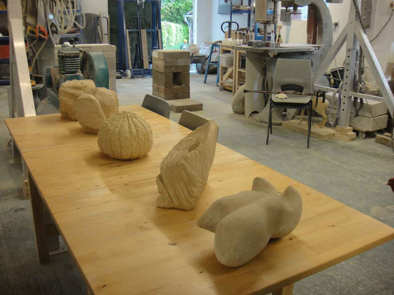 Several stone carvings lying on a table