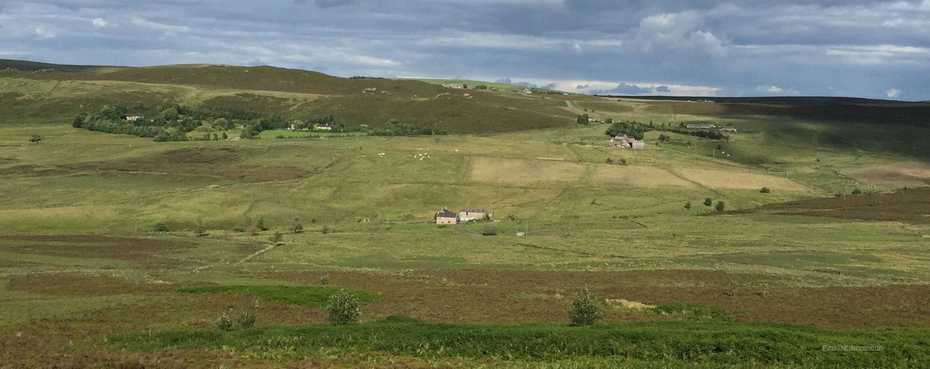 Shawbottom viewed from the hillside, isolated and standing alone in the valley