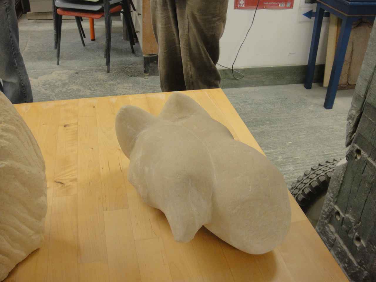 A stone carving lying on a table