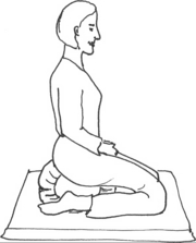 Kneeling using a cushion