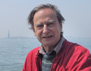 John Crook, at Battery Park with the statue of liberty in the far distance behind him